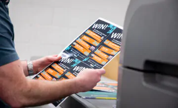 Person inspecting a fresh print